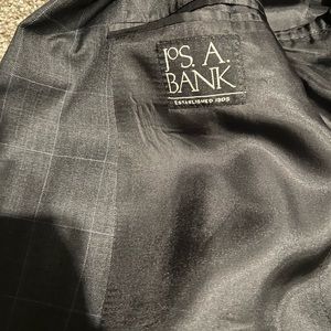 Jos a Bank 42r charcoal 2 button single vent with light blue stripes